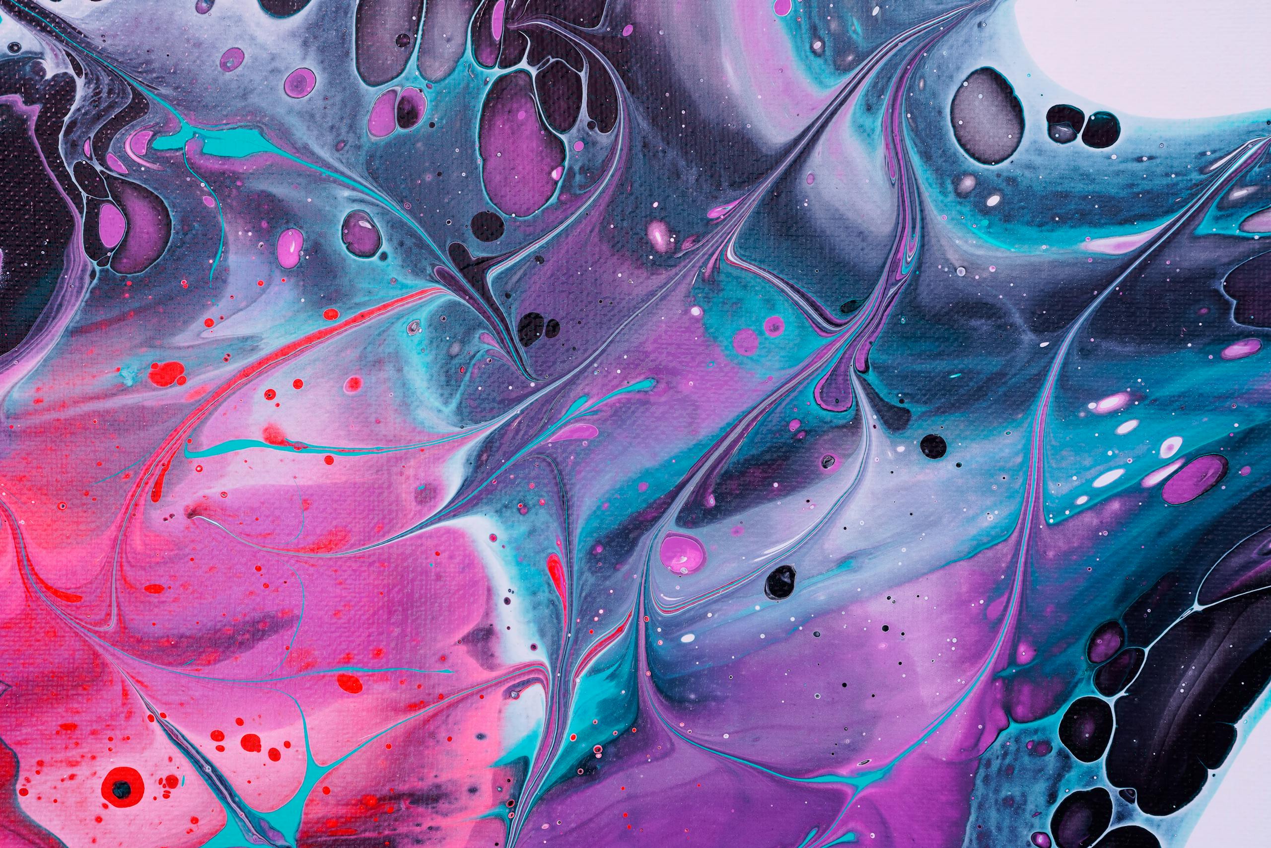 Vibrant swirls of color in abstract fluid art creating a psychedelic pattern.